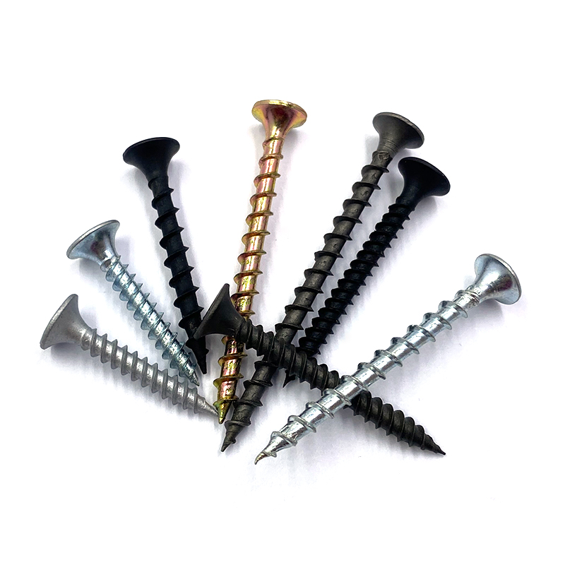 different types and sizes of nails and screws on a wooden table Stock Photo  - Alamy